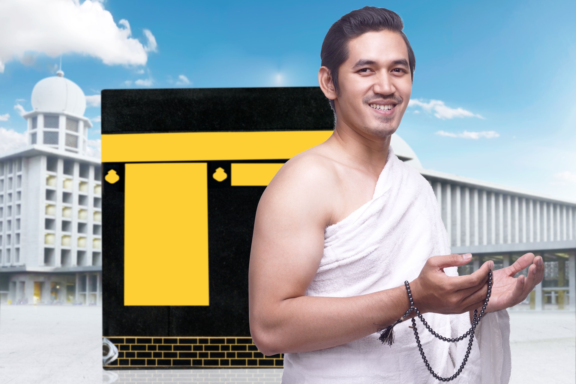 Asian Muslim man in ihram clothes standing and praying with prayer beads