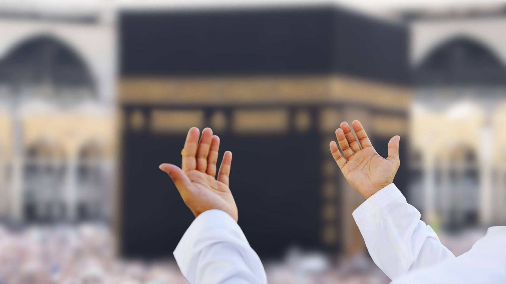 Muslim praying to Allah in front of Kaaba.