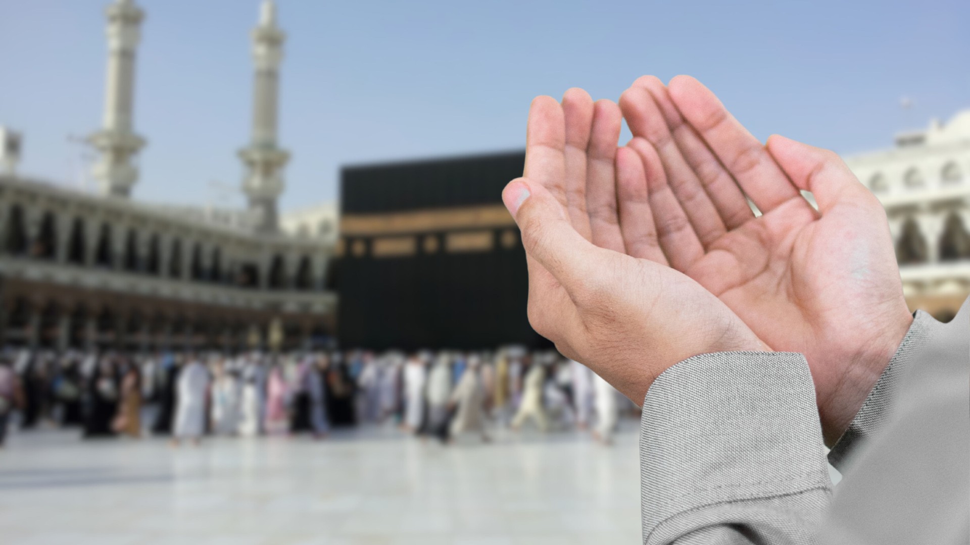 Muslim praying to Allah in front of Kaaba. Islam Iconic Mosque, Al Haram Mecca Saudi Arabia. Muslim Praying Hands in front of The Holy Kaaba which is the center of Islam inside Masjid Al Haram Mecca.